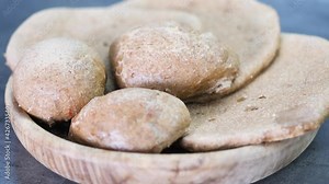 Close up homemade peasant bread made of buckwheat and rye with no yeast. Top view with negative space. Video footage 4K