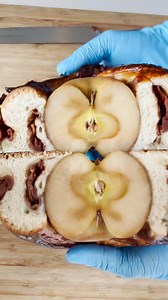 An entire apple rolled up inside a round challah is the most-beautiful Rosh Hashanah centerpiece yet 🍎✨Get it from Breads Bakery! #FoodNetworkFinds | Food Network