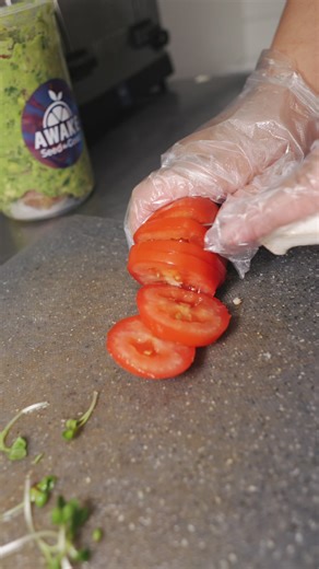 Fresh. Spicy. Addicting. 🥑💥 Smashed avocado mixed with jalapeño, cilantro, lime, and onion, stacked with sprouts and tomato. Get it before it’s gone. #Awake