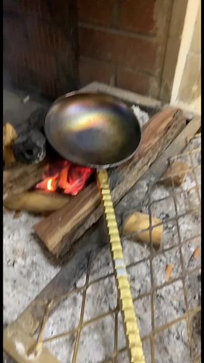 Captivating Close-Up of Frying Pan Over Open Fire