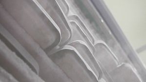 Slow motion. Steam from the freezer drips down the packages