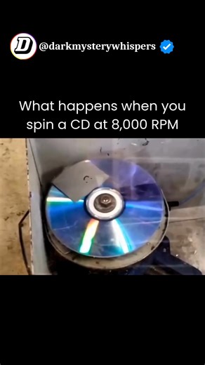 Dark Mystery Whispers on Instagram: "💿 When a CD is spun at an extreme speed of 8,000 revolutions per minute, it transforms from a simple music disc into a breathtaking physics experiment. The intense rotation causes light to diffract into vivid rainbow patterns while the plastic surface begins to heat up and warp. At this point, the microscopic pits that normally store digital data appear like rippling waves under the stress. As the speed builds, reflections form a hypnotic spiral of color unt