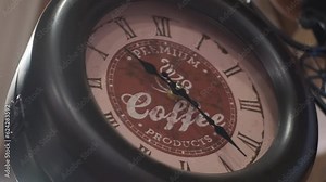 City old street clock next to coffee close-up