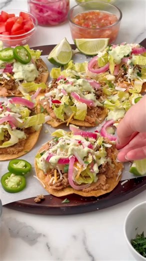 Tostadas are crispy, messy, flavor-packed perfection! 🌮 Drop RECIPE below for the full printable ingredients list & instructions 👇 These aren't your average toppings-on-a-tortilla kind of deal. This recipe takes tostadas to the next level with seasoned beef, spiced beans, and the creamiest avocado cilantro crema that'll have you licking your fingers! Ready in about 30 minutes for an easy weeknight dinner the whole family will devour! https://www.thefreshcooky.com/tostada/ #Tostadas #MexicanFoo
