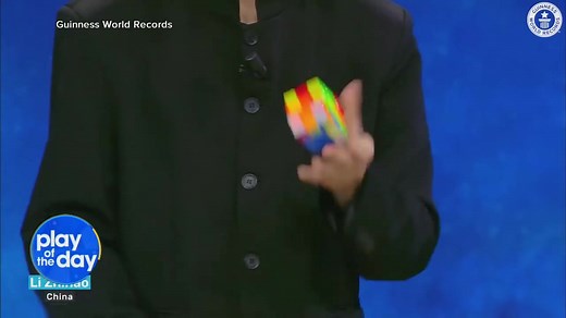 PLAY OF THE DAY: A 22-year-old from China sets a new world record by solving three Rubik's cubes all while juggling them. | Good Morning America
