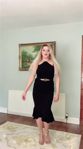 Blonde Woman Dances Elegantly in Indoor Setting