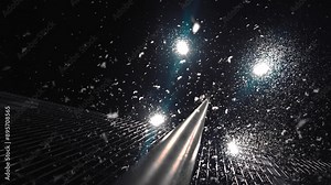 The night lantern is surrounded by a huge flock of moths that have flown into the light. They circle around the lanterns