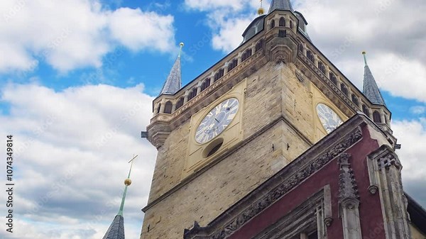 The building of the old city administration in the center of Prague. Stone clock tower in Western Europe. Medieval town hall against the background of the sky with clouds.