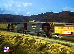 A pre-merger pairing of Union Pacific and Southern Pacific on the SP's Palmdale cut-off through Cajon Pass. From "Railfanning Cajon & Tehachapi" by Charles Smiley. Great footage from the 1970s through the 1990s. https://rfd.video/Cajon | Railfan Depot