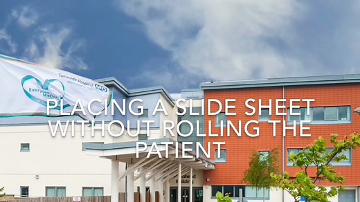 Placing a slide sheet without rolling a patient