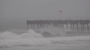 1.8K views · 23 reactions | TRACKING SALLY: A sign warns of dangerous surf while flags rip in the wind, as huge waves hit the normally massive Pensacola Pier in Florida https://bit.ly/3mmeMk7 | CBS Austin | Facebook