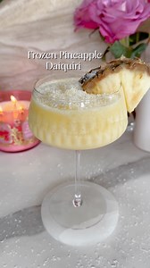 Frozen Pineapple Coconut Daiquiri One of a kind drink that will make you feel like you are sitting in the Caribbean on a beach! This tasty frozen cocktail is so easy to make and just hits perfect at that first sip! Make sure to like and comment if you end up making it and let me know what you think! #pineapple #daiquiri #frozendrinks #frozencocktails #summer | Styled By Daisies