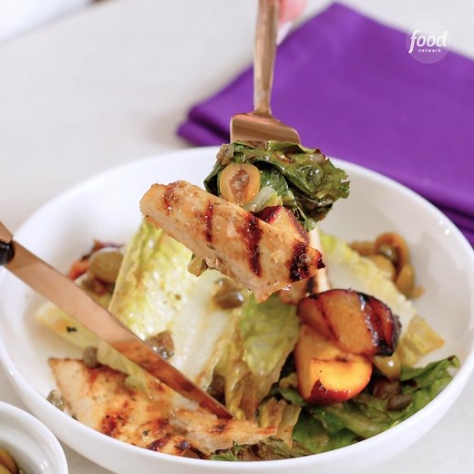 Chicken Marbella meets panzanella in this grilled summery salad with stone fruit, olives and capers! Get the recipe: https://foodtv.com/3xT6ers | Food Network