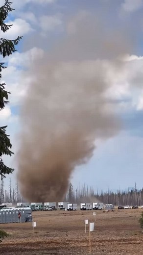 TheHotshotWakeUp: Substack/Podcast on Instagram: "Massive dust devil rolling through the Emigrant Fire camp today. This Oregon fire is now 30,576 acres and 0% contained. The fire has bumped down to the primary control lines and crews along with UAS drone systems are keeping an eye out for any spot fires or flare ups. The fire added nearly 5,000 acres yesterday and burned actively through the night. The Willamette National Forest is expecting more lightning today and are preparing for more initia