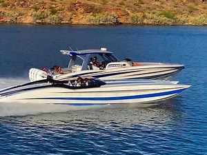 CHAOS & MAYHEM! George Argyros’ MTI 42-V center console “Chaos” runs alongside his matching MTI 48’ catamaran, “Mayhem” for quite the photo opp for our Speedboat shoot. Image by Todd Taylor @toddtaylorimages / Fred Young @the_fred_young @mtiboats @taylor.scism @tstuart211 @miltoncalafell @cherellscism @mercuryracing @mercurymarine #chaos #mayhem #marinetechnologyinc #george #photoopp #beautiful #sidebyside #speedboatmagazine #photoshoot | Speedboat Magazine