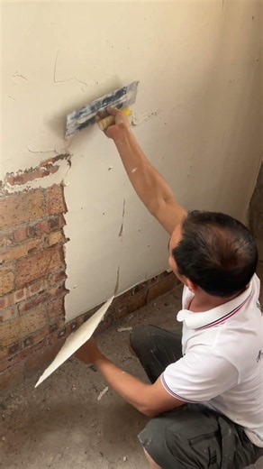 🧱 Wall Repair Hack: Skimming Plaster Over an Exposed Brick Wall! 🏗️ #shorts
