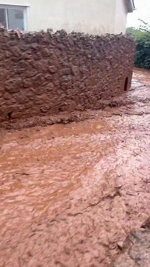 Heavy rain in Luton, Devon has caused significant flooding. This road has turned into a river, video captured by John Burton. #flood #heavyrain | Exploring GB