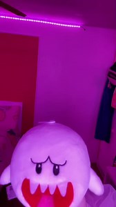 King Boo Returns with Plush Toy in Purple Room
