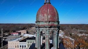 A specific type of structure which houses a turret clock, the Henry County Courthouse Clock Tower - Paris, Tennessee. Aerial shot.
