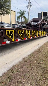 Our 55-Ton lowboy, outfitted with air ramps, a flip axle, and finished in ‘Glamour’ Chocolate and ‘Bright’ Yellow powder coat. #TrailerShowcase #GlobeTrailers #Trucking #CustomBuilt #Merica #Custom #HeavyHaul #HeavyEquipment #Transport #MadeInTheUSA | Globe Trailers