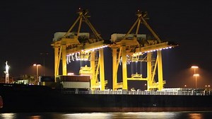 Small Business Export Cargo ship moving load at port Time lapse.