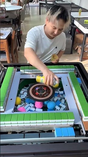 automatic mahjong table that shuffles and stacks tiles automatically.