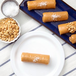 51K views · 418 reactions | Rolled up cake and jam are doused in peanut butter ganache and covered in salt or crumbled peanuts. | Sugar Fix | Facebook