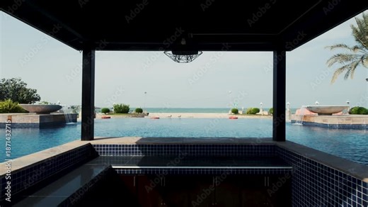 infinity swimming pool in tropical resort with pool side beach bar, luxury travel and holidays concept stock video in 4k res