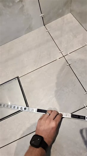 Sam Edwards on Instagram: "“⚒️ Precision makes perfection! Every mark, every cut — planned so the water flows exactly where it should 💧 Laying the tiles with the perfect fall to the drain — no puddles, no guesswork, just smooth flow and clean lines 👌 This is how you turn a plain floor into a professional finish 🔥” #tiling #bathroomgoals #wetroom #tilework #buildersofinstagram #homeimprovement #insta #fyp #trade #satisfying"