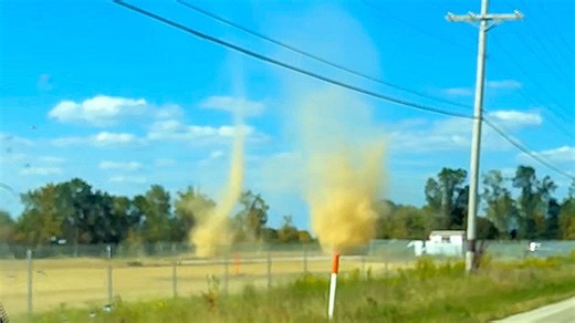 Dust devils merge into single funnel