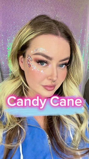 Minimal paint but so cute for a fun little holiday look. #facepainter #facepaint #candycane #styledbymagic #christmasmakeup #HolidayMagic #holodaymakeup #tutorial #facepainttutorial #diy #christmascountdown #socute | Squishy Doodle Face Painting