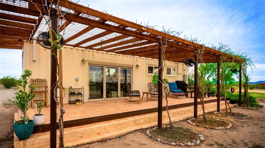 Living in her beautiful container tiny house next to mom's shed home