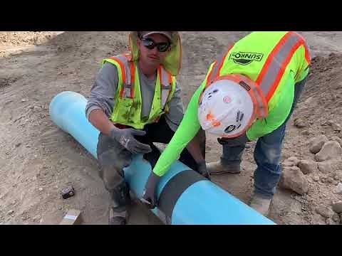 Using a pipe wrap to mark a cut line