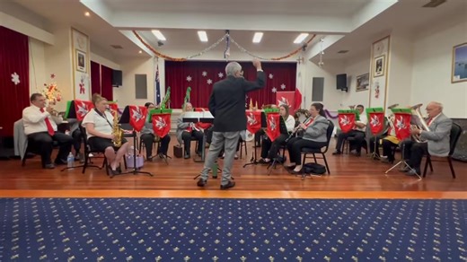 On Thursday night, we had the pleasure of performing a Christmas Carol Concert for the Maltese Cultural Association of Victoria at our home base in Albion. The hall was beautifully decorated with classic Christmas décor and twinkling fairy lights, creating a truly festive atmosphere. With a full house and a wonderfully engaged audience, the night was a great success and a joyful way to share the spirit of Christmas with our community. Please enjoy this video of the band performing “Ninni la tibk