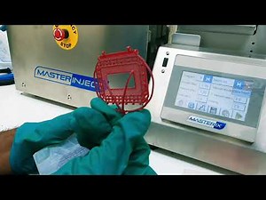 Injecting wax into rubber mold for casting jewelry