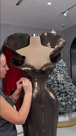 Share with a friend who would own the spotlight in this metallic silver ball-gown! To order, send us