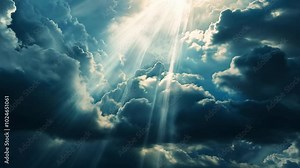 Sun Rays Through Clouds: A dramatic sky with vibrant sun rays piercing through majestic dark clouds, creating a beautiful and ethereal atmosphere. The sun's beams illuminate the clouds.
