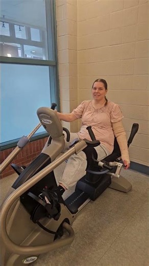 C5 /C6 BSS spinal cord injury tetraplegia quadriplegic riding Nustep with knee support. 11 months in