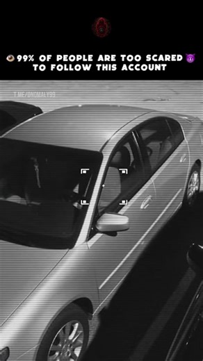 Traffic camera footage, highway interchange. White sedan driving normally. Late evening traffic. Standard commute. Then something appears in the driver's seat. A glowing orb. Bright pulsating light. Not a reflection. Inside the vehicle. The car continues driving straight. Steady speed. No swerving. The light intensifies. Flickers rapidly. Camera glitches from the brightness. Static interference. The orb suddenly expands. Fills entire cabin with white light. Then vanishes instantly. The car is em