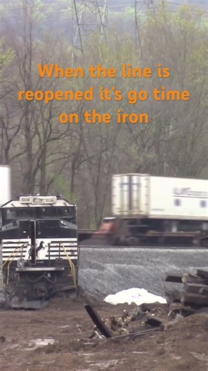 Hot shot 20K passes a derailed train in Matawanna