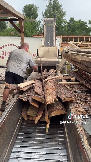 Industrial Wood Chipper: Massive Log Shredded into Uniform Wood Chips
