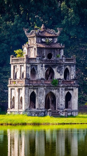Turtle Tower stands out in the middle of the gentle Hoan Kiem Lake, Hanoi, Vietnam. Legends say a golden turtle reclaimed Emperor Le Loi's magic sword here. Check on the video to see how augmented reality resurrects mythic ripples beneath mirror-like waters.#TangArchitecture #SoutheastAsiaTour2025 | CGTN