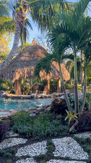 4.5K views · 126 reactions | This tropical lagoon in Englewood, Florida, was designed to mimic an old Florida swimming hole. Featuring a natural rock grotto waterfall, lush landscaping, and natural rock paths leading you from one destination to another. #insanepools #lucaslagoons | Lucas Lagoons Design | Facebook