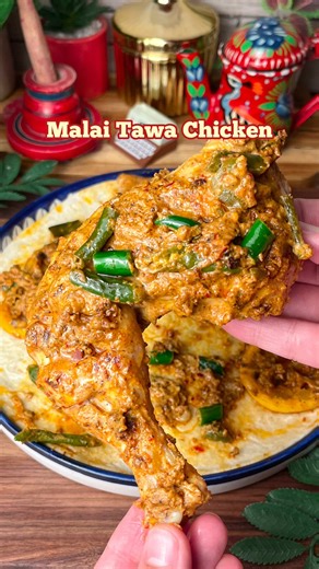 Malai Tawa Chicken Ingredients: 2 chicken legs(400gms) 1 cup yogurt 5 garlic cloves 2 green chilies Half cup thick cream 1 tsp black pepper 1 tsp chili flakes 1/2 tsp chili powder 1/2 tsp chaat masala 1 tsp cumin powder 1 tsp garam masala 1 tsp salt 1 tbsp lemon juice 4 tbsp oil 3-5 green chilies for garnish 3-4 lemon slices for garnish Put slits on the chicken as shown. Marinate the chicken with the yogurt mixture. On a tawa/pan place the chicken, let it cook for 4-5 min each side and get a nic