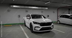Generic electric crossover car connected to charging box. EV vehicle plugged in energy station, recharge battery at shopping mall or urban city house parking lot. 3D animation