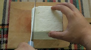 Cutting traditional bulgarian white cheese Stock Video