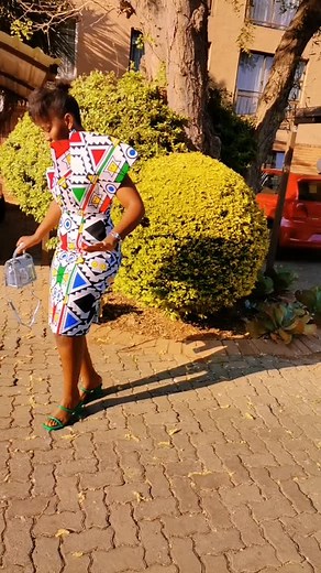 Fashionable Outdoor Walk in Colorful Geometric Dress