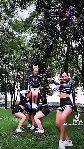 a small group of cheerleaders dancing