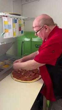 Making a double-pepperoni pizza at BBops in Madison, Indiana !