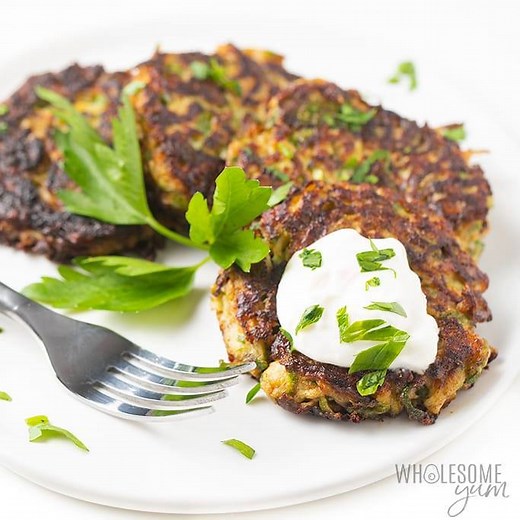 Family-friendly and keto-friendly, these Zucchini Fritters will be a hit at your dinner table. The perfect way to get the kids to eat their veggies. Add this low carb recipe to your menu this week. Printable Recipe: https://www.wholesomeyum.com/zucchini-fritters-recipe/ | Wholesome Yum - Easy Healthy Recipes